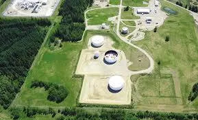 Aerial view of a tank farm with storage tanks inside graded secondary containment berms
